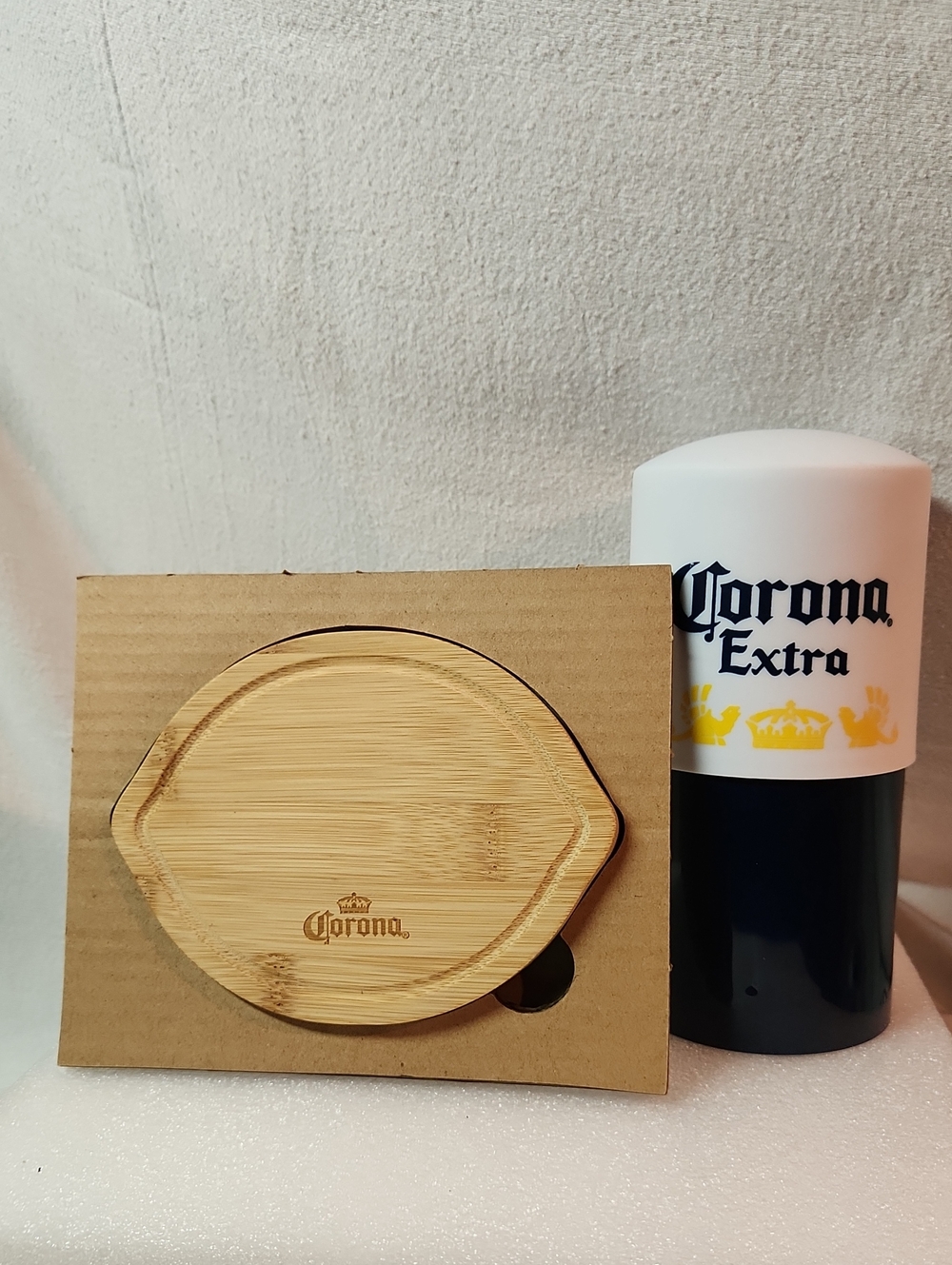 together is a Corona Extra lemon cutter and a board with integrated knife